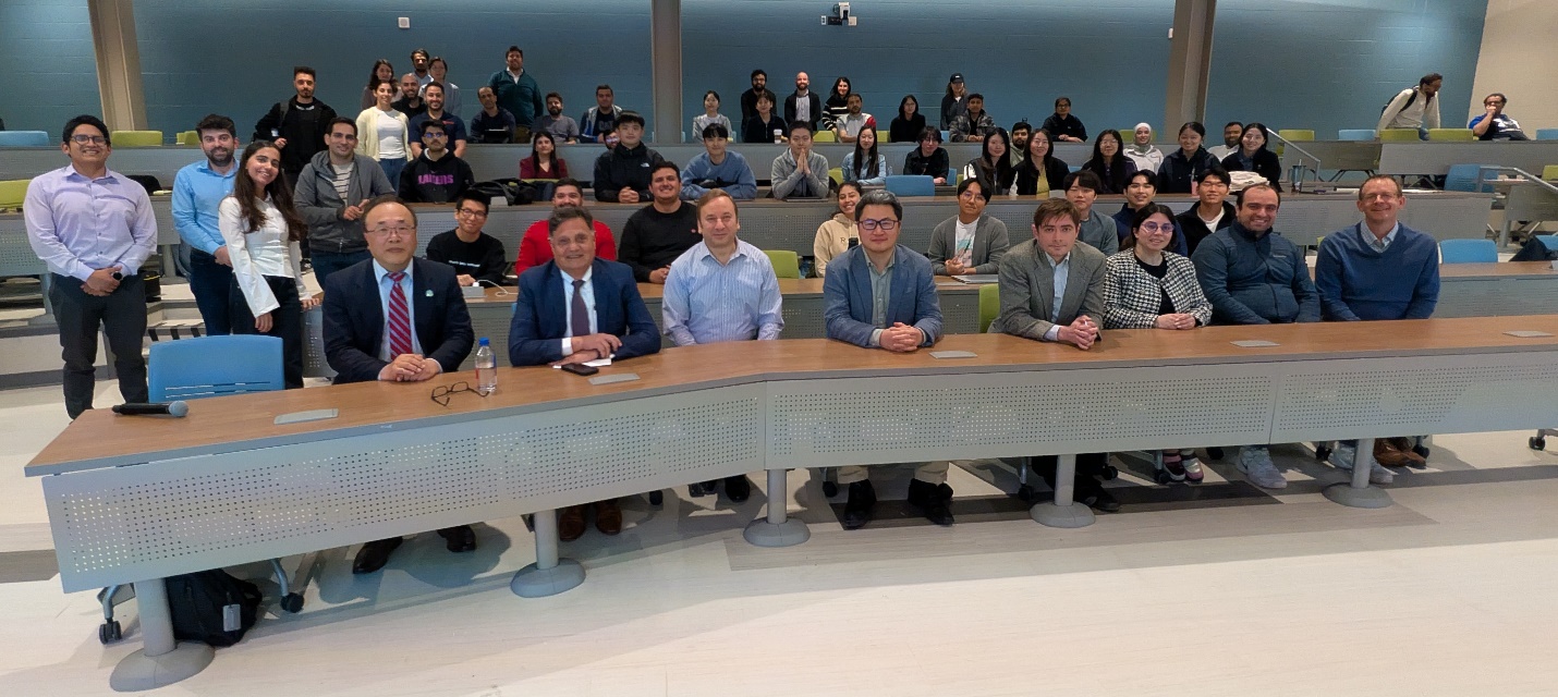 Yinhai Wang (first row, far left) with Department of Civil and Environmental Engineering faculty and students on April 21 after delivering the annual Kent Seminar Distinguished Lecture.