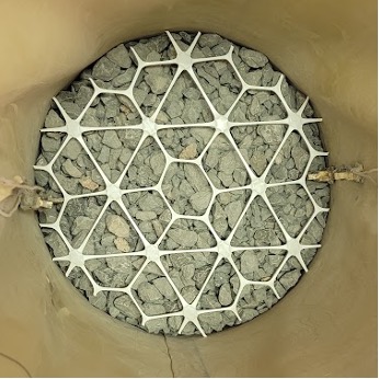 A geogrid in a triaxial test setup.