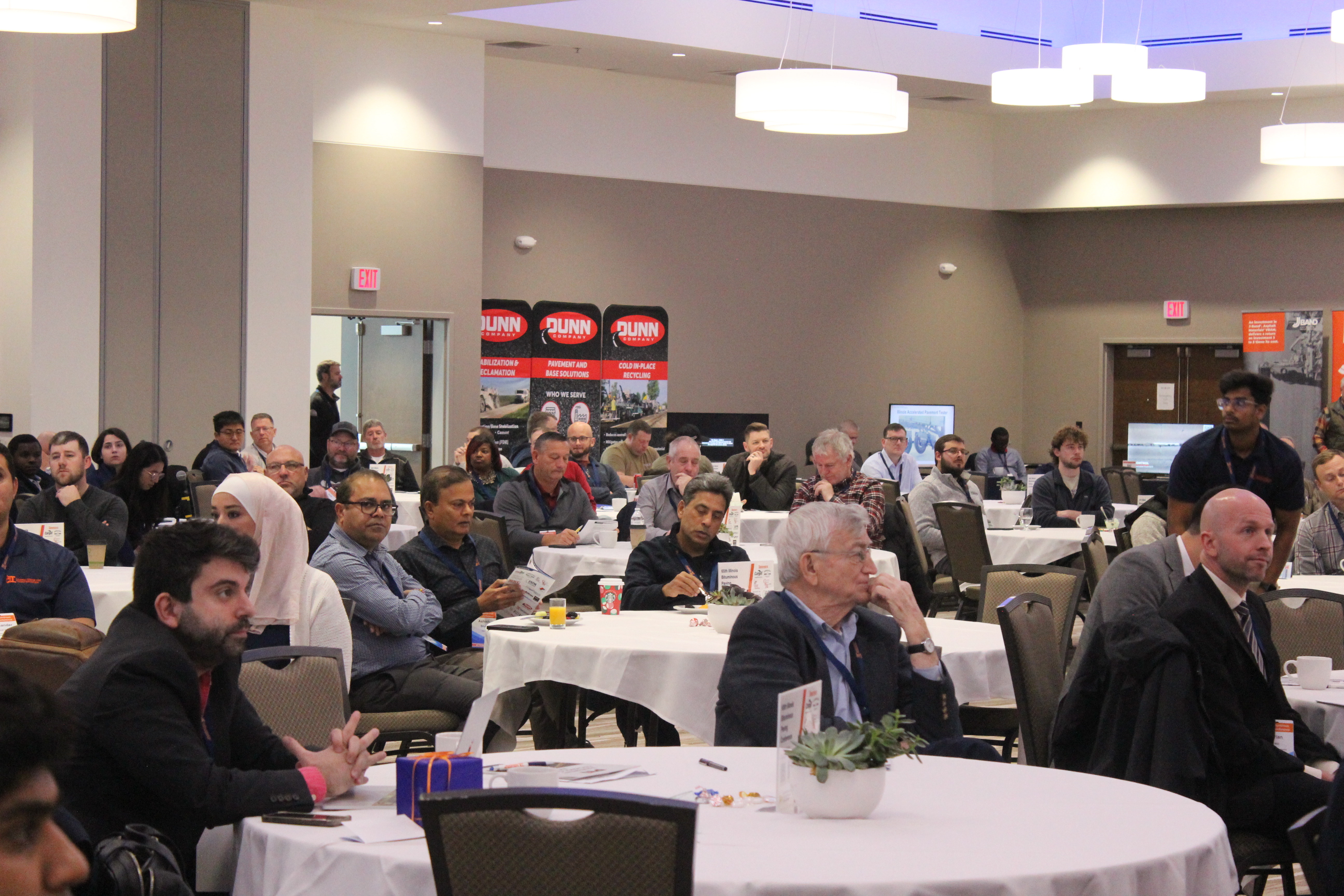 A group of attendees listening to a presentation at the 65th Illinois Bituminous Paving Conference.