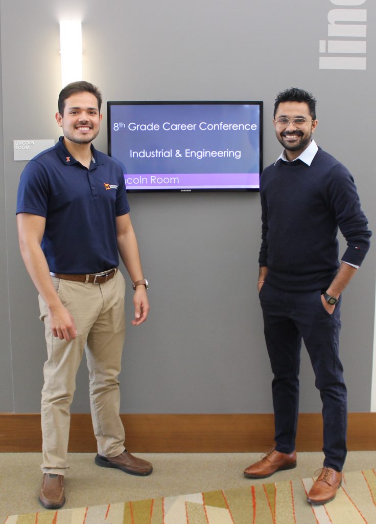 Jos&eacute; Rivera-Perez, left, and Punit Singhvi, UIUC CEE doctoral students, were all smiles at the 29th annual 8th Grade Career Conference, where they shared their passion about transportation engineering.