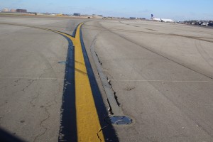 New taxiway lights cause spalling at the interface and create foreign object debris, which can pose safety concern for aircrafts.