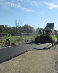 Hot mix asphalt paving on top of the QB stabilized test sections.