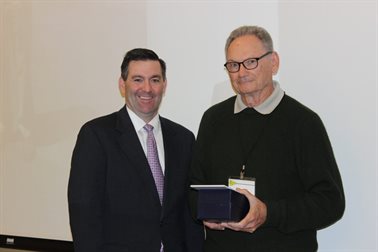 IAPA Executive VP Kevin Burke presents Robert Bailey with Bituminous Achievement Award.