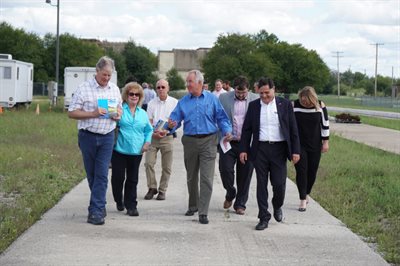 Congressman John Shimkus and other visitors join ICT Director Imad Al-Qadi for a walk around the grounds.