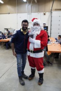 Punit Singhvi and Santa share a laugh at the annual Winter Open House.
