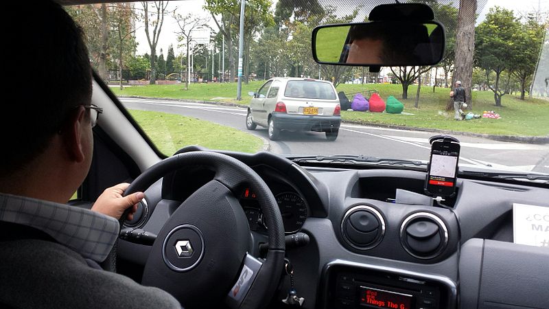 An Uber driver takes passengers to their destination in Bogot&aacute;, Colombia.