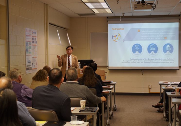 Imad Al-Qadi, ICT director and UIUC Department of Civil and Environmental Engineering professor, chats about the Illinois Automated and Connected Track with local leaders earlier in April.