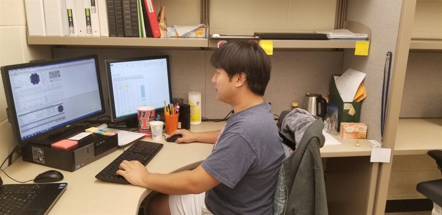 UIUC CEE doctoral student Hongjae Jeon works on a transportation research project at his desk.