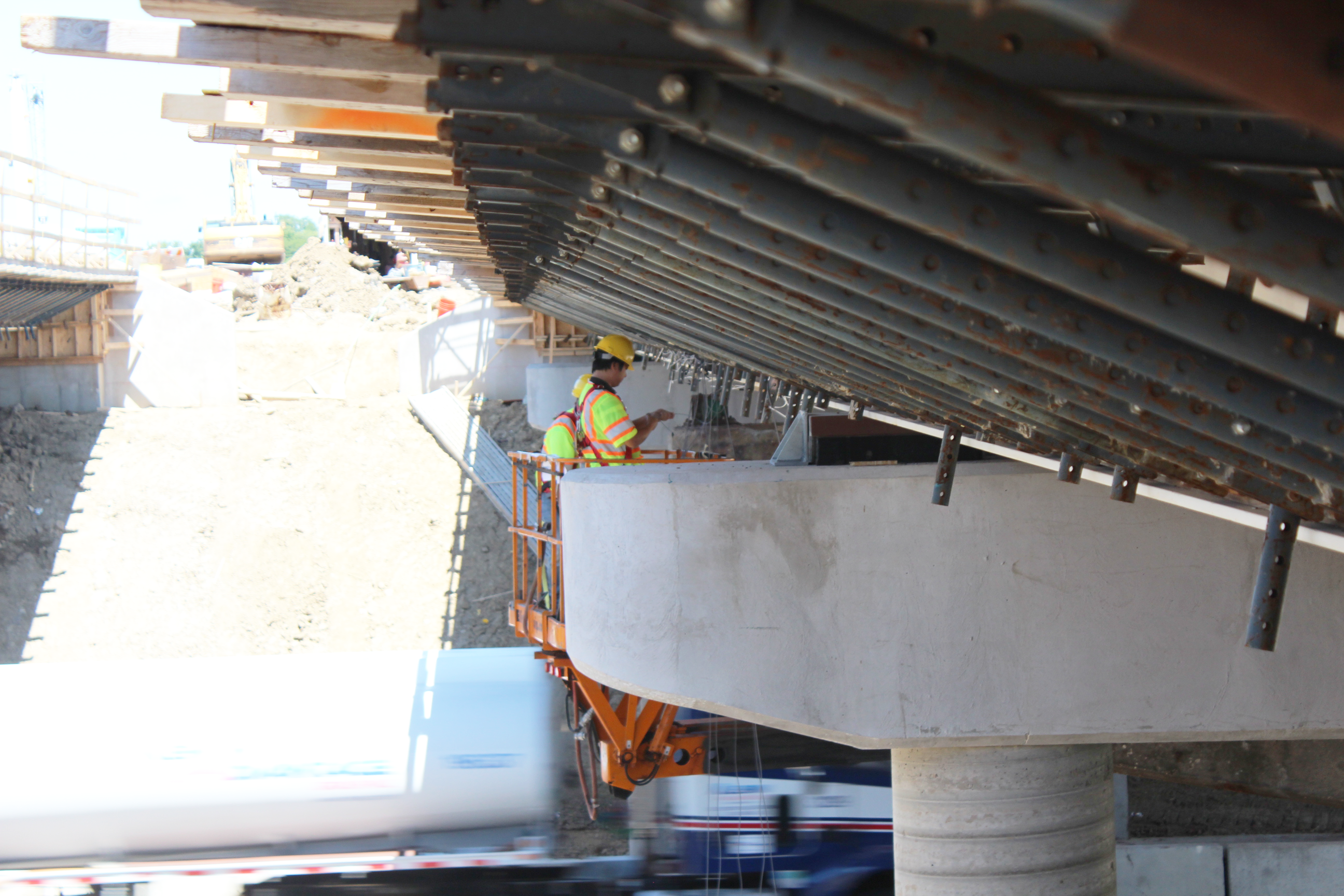 Former SLU scholar Li Hui monitors bridge construction as part of his two-phase project addressing exterior-beam rotation during bridge deck construction.