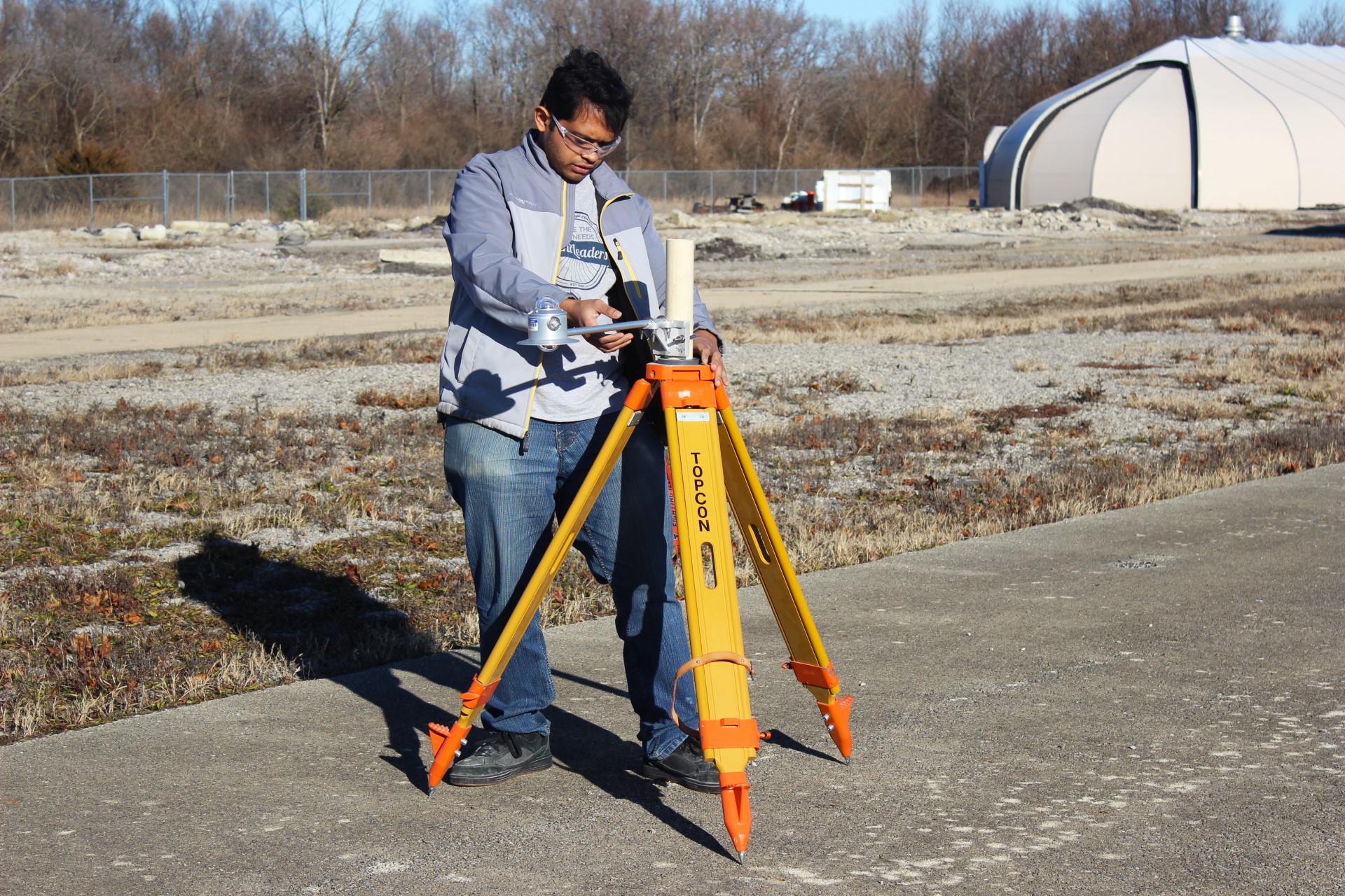 Sushobhan Sen, UIUC CEE alumnus and University of Pittsburgh postdoctoral researcher, sets up an albedometer earlier on Dec. 4 at Illinois Center for Transportation, where he conducted pavement reflectance experiments. The device measures the solar energy and the energy reflected from pavement surfaces to determine air and surface temperatures.
