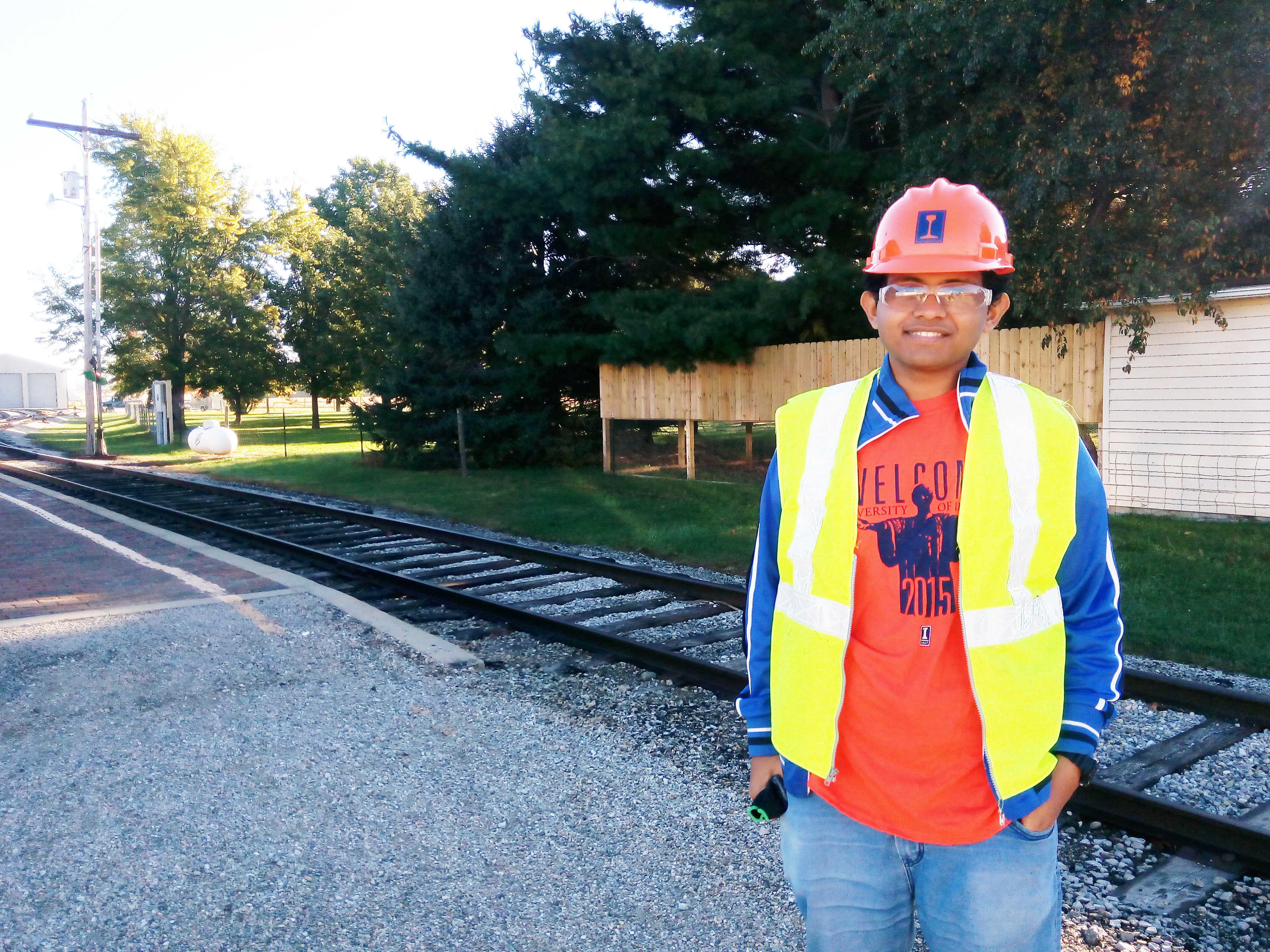 Sushobhan Sen poses for a photo sporting his CEE gear at an earlier field trip to the Monticello Railway Museum.
