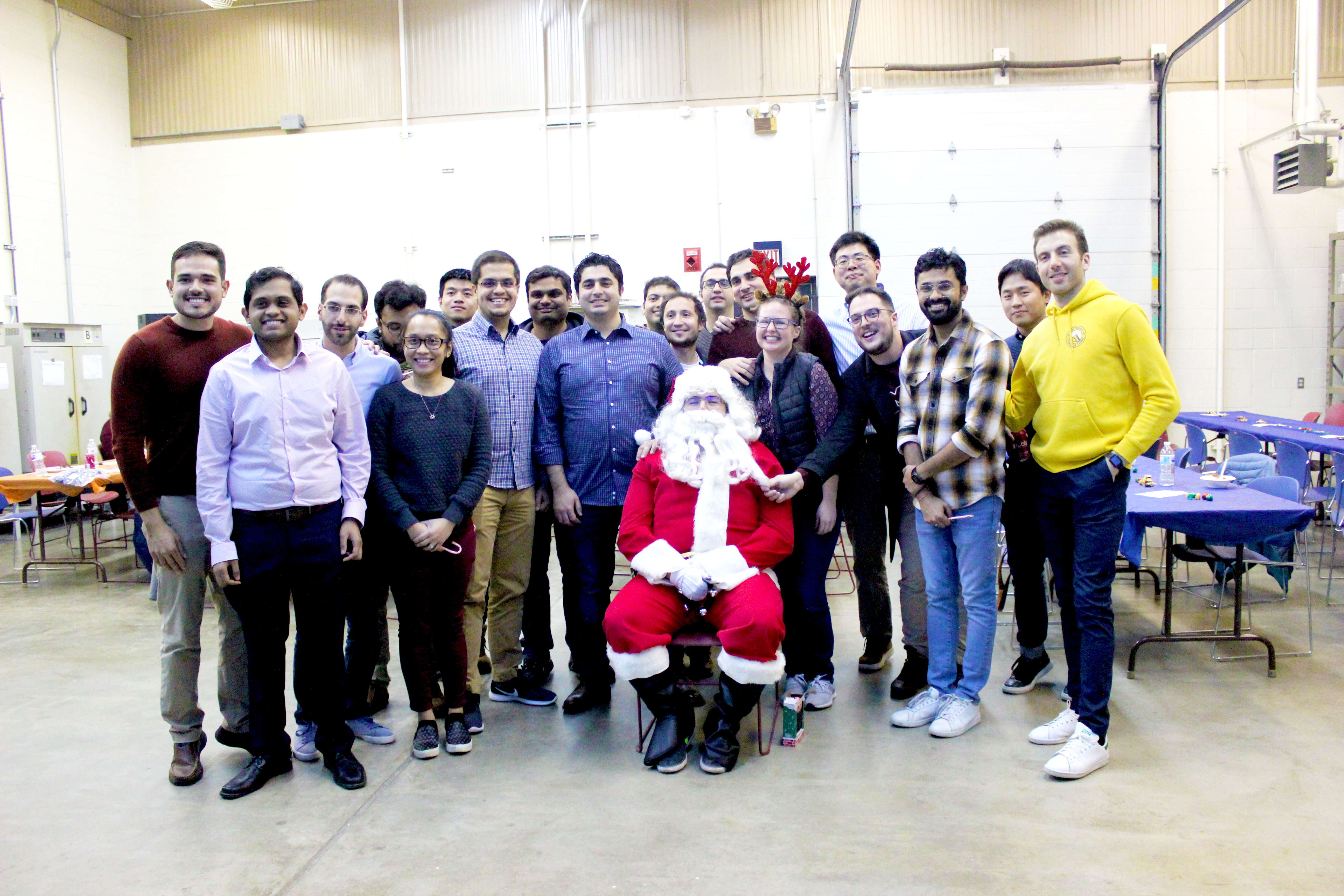 UIUC CEE students strike a pose with Santa Claus during the Dec. 3 Winter Open House at Illinois Center for Transportation in Rantoul, Ill.