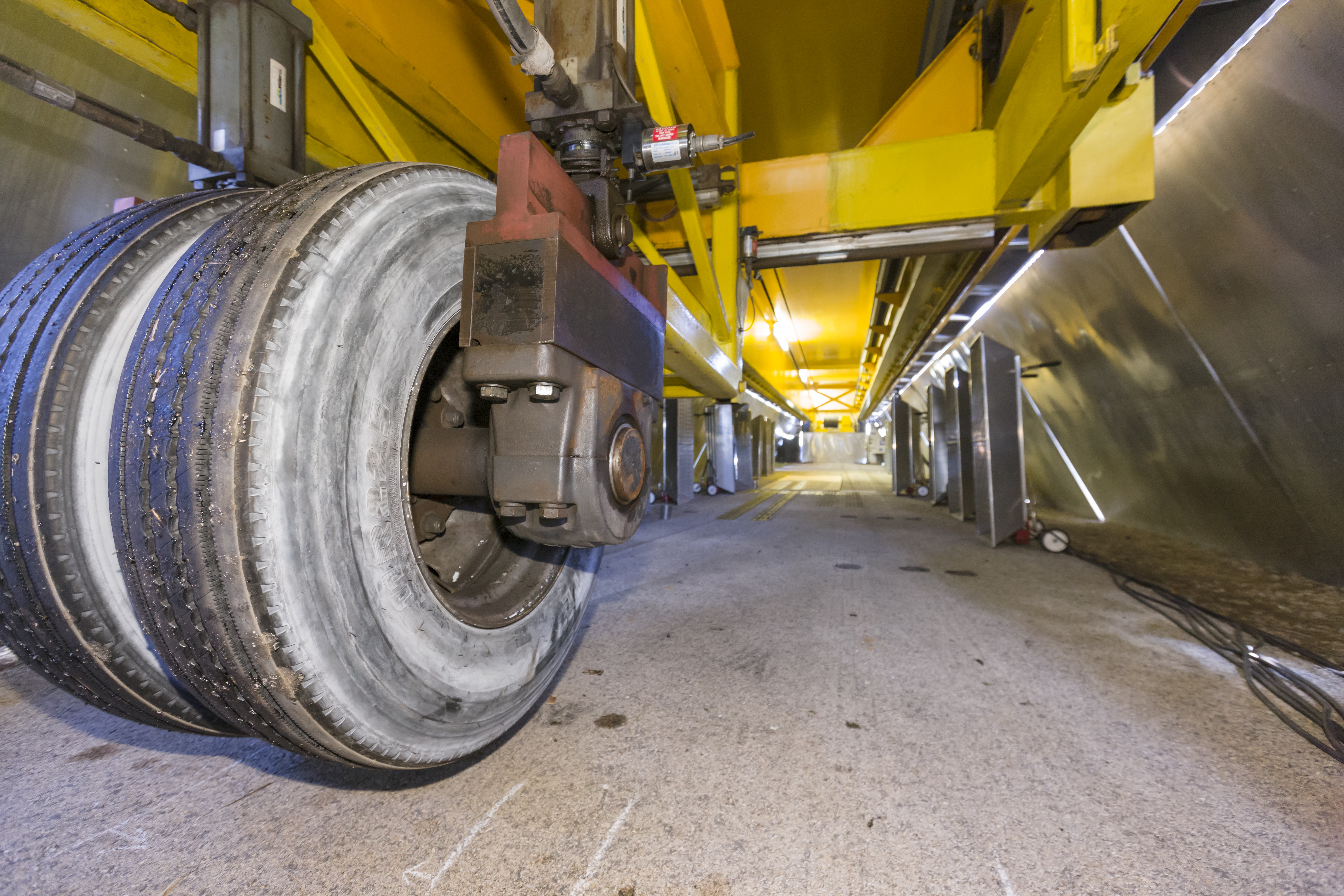 Here ATLAS loads the pavement with a conventional dual tire assembly. The environmental heaters can be seen in the background.