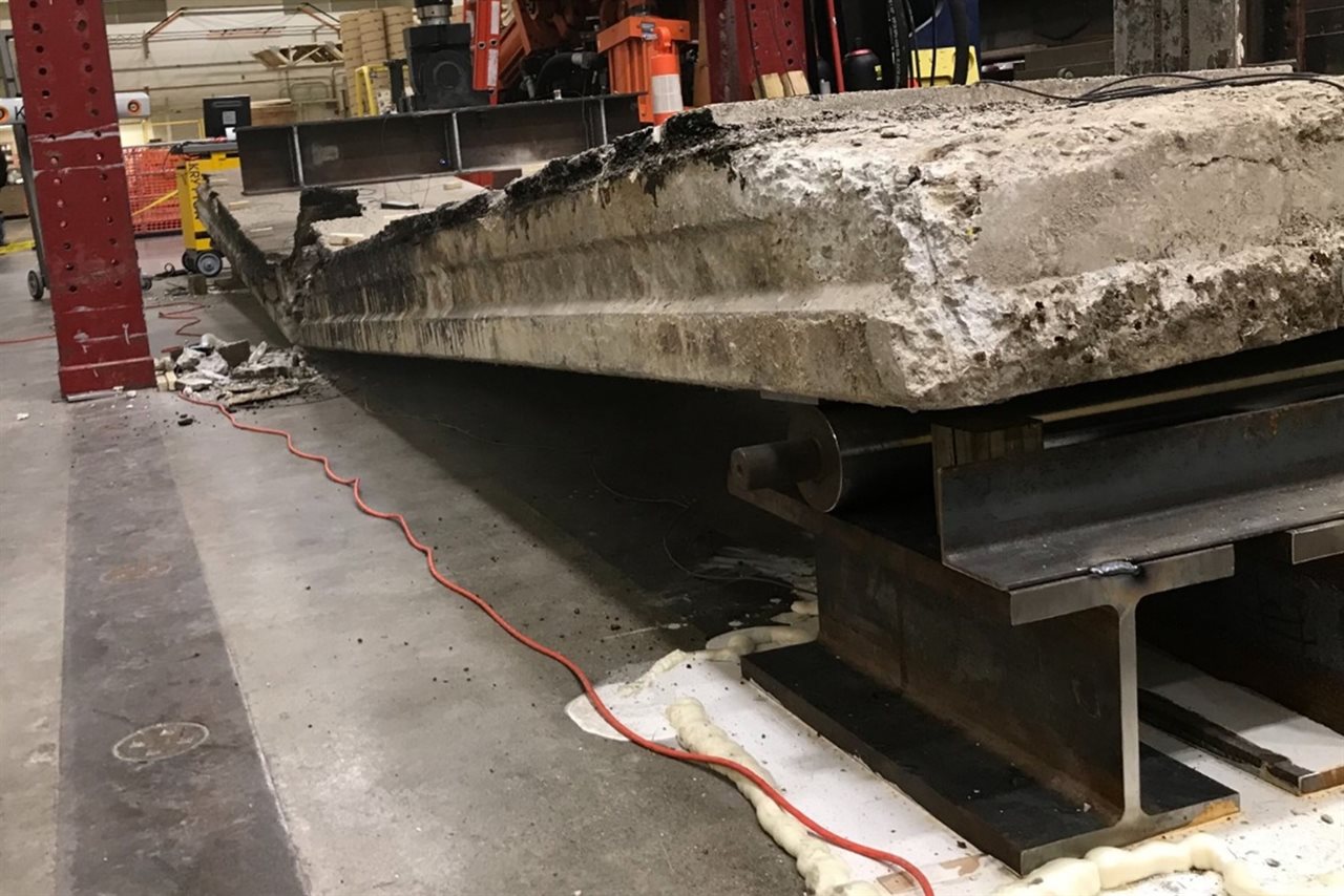 &lt;span style=&quot;font-size: 0.8em;&quot;&gt;Provided by Thomas Golecki &lt;/span&gt;&lt;span style=&quot;font-size: 0.8em;&quot;&gt;and Bill Spencer. &lt;/span&gt;&lt;span style=&quot;font-size: 0.8em;&quot;&gt;A bridge beam rests after undergoing a destructive test at the University of Illinois at Urbana-Champaign&rsquo;s&nbsp; Newmark&lt;/span&gt;&lt;span style=&quot;font-size: 0.8em;&quot;&gt; Structural Engineering Laboratory. The beam supported a load of 33.14&nbsp; kips&lt;/span&gt;&lt;span style=&quot;font-size: 0.8em;&quot;&gt;&nbsp;(33,140 pounds) before failure.&lt;/span&gt;