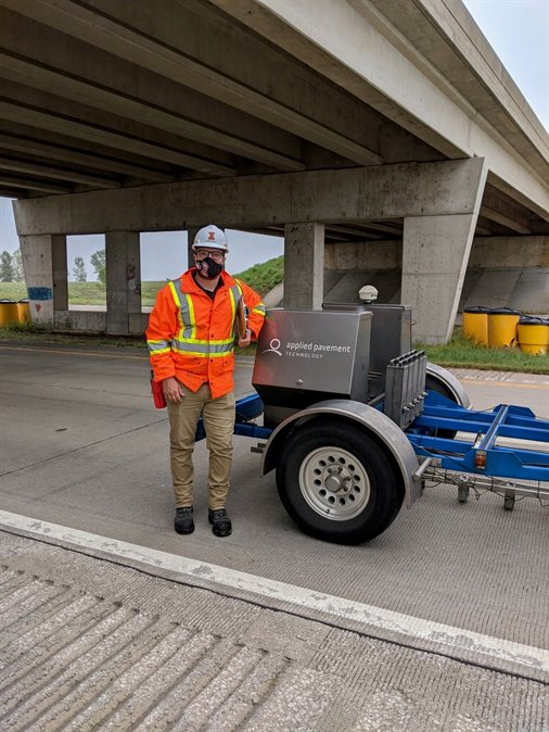 [cr][lf]&lt;p&gt;Jordan Oullet, a CEE doctoral student, strikes a pose with a heavy weight deflectometer, which applies a dynamic load to the pavement simulating the loading of a truck in Hannibal, Mo. on Sept. 10. Here Oullet helped measure the structural capacity as well as monitor distresses of jointed plain concrete pavement along Interstate 72.&lt;/p&gt;[cr][lf]