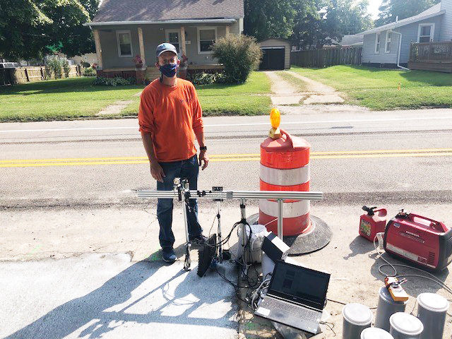 Jeff Roesler, UIUC's associate head for Graduate Affairs and CEE professor, poses alongside equipment needed for a noncontact untrasonic test for concrete setting time of high volume fly ash concrete in Canton Ill. on Sept. 21.