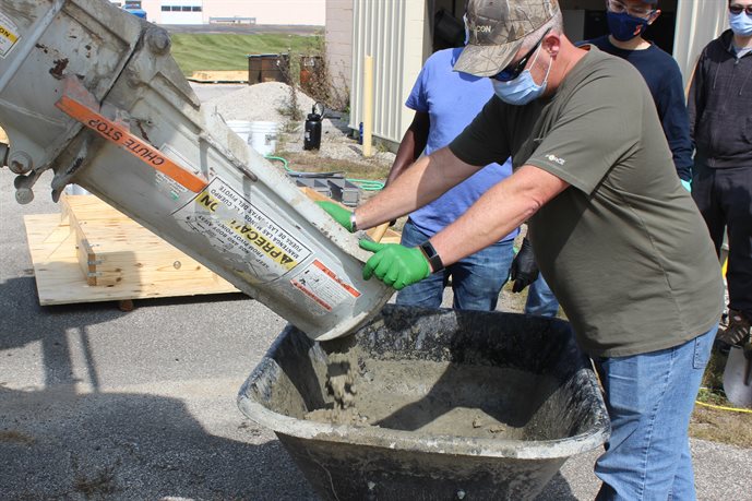 Greg Renshaw, ICT&rsquo;s senior research engineer, pours concrete to assist in the IDOT-sponsored project at ICT on Sept. 22.