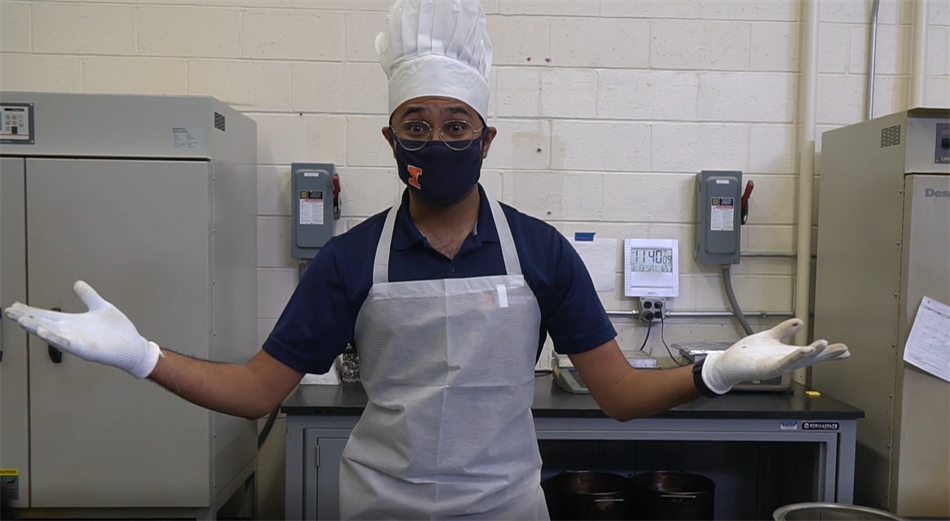 Punit Singhvi, a UIUC doctoral student, dons a chef hat while filming the "Life of Asphalt" short film for the March 26-27 Engineering Open House, where he and other graduate students showcased the ingredients necessary to make the perfect asphalt mixture recipe.