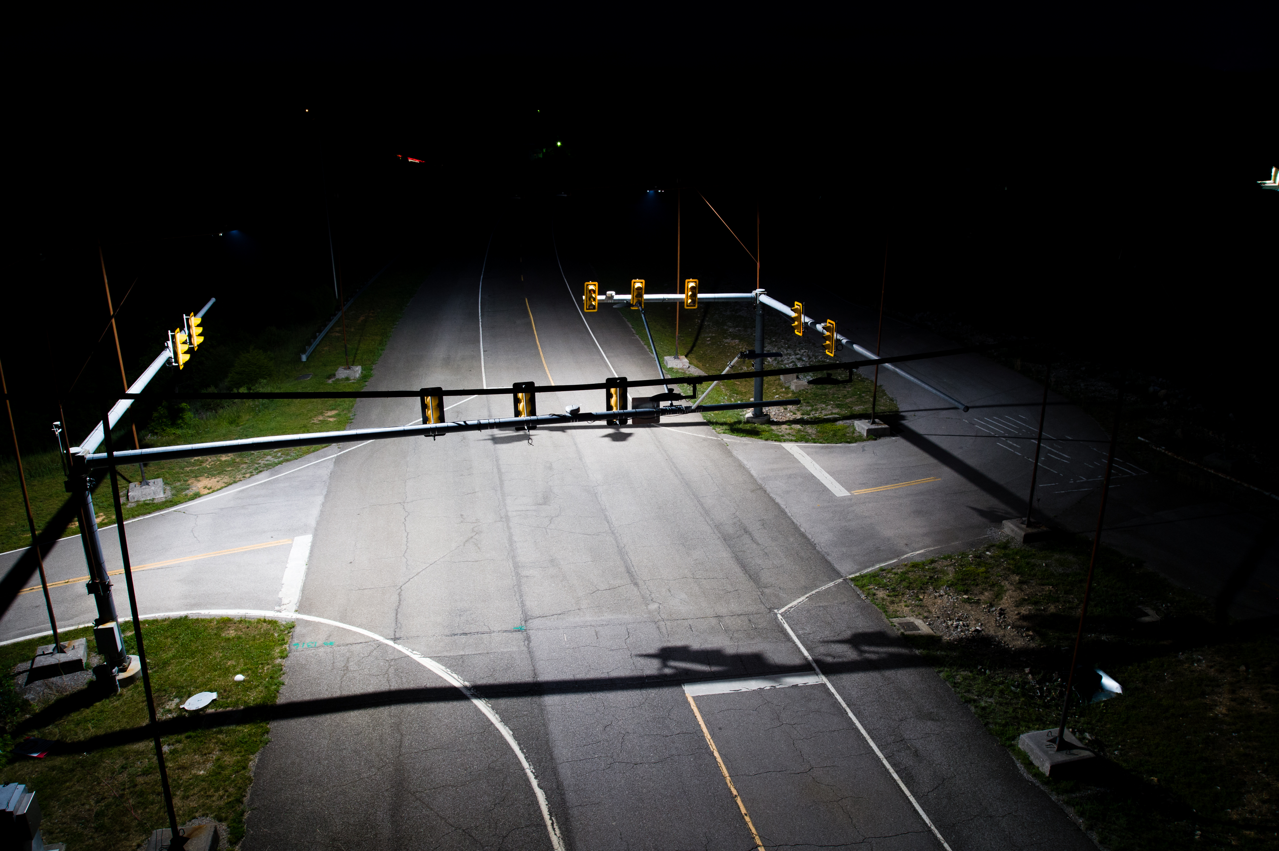 Provided by Rajaram Bhagavathula. An intersection on Virginia Tech Transportation Institute&rsquo;s Smart Road demonstrating Illinois Department of Transportation&rsquo;s lighting design, one of four intersection lighting designs tested in the ICT-IDOT study. The lighting at the intersection and midblock locations is controlled by smartphone, allowing the researchers to switch between the four lighting designs while riding with drivers participating in the study.