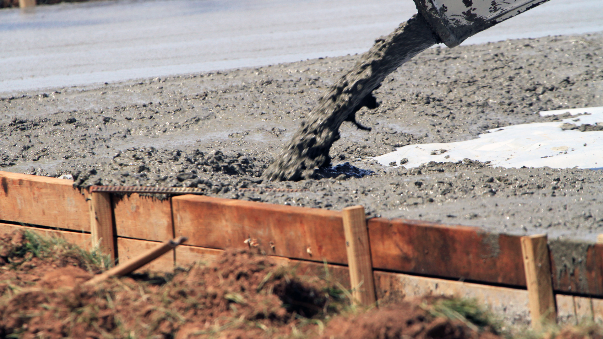 Curing, which occurs after concrete is placed, provides water retention to facilitate cement hydration, thereby reducing permeability, increasing strength gain and minimizing concrete cracking.