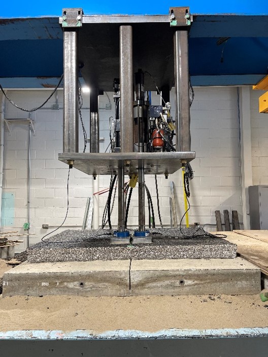 The two-actuator servo-hydraulic system for the large-scale laboratory testing of asphalt overlays on concrete slabs. The one-of-a-kind setup, invented by&nbsp;ICT senior research engineer Uthman Mohamed Ali, simulates the effects of vehicles&rsquo; loads and movement over joints in the underlying concrete slab.