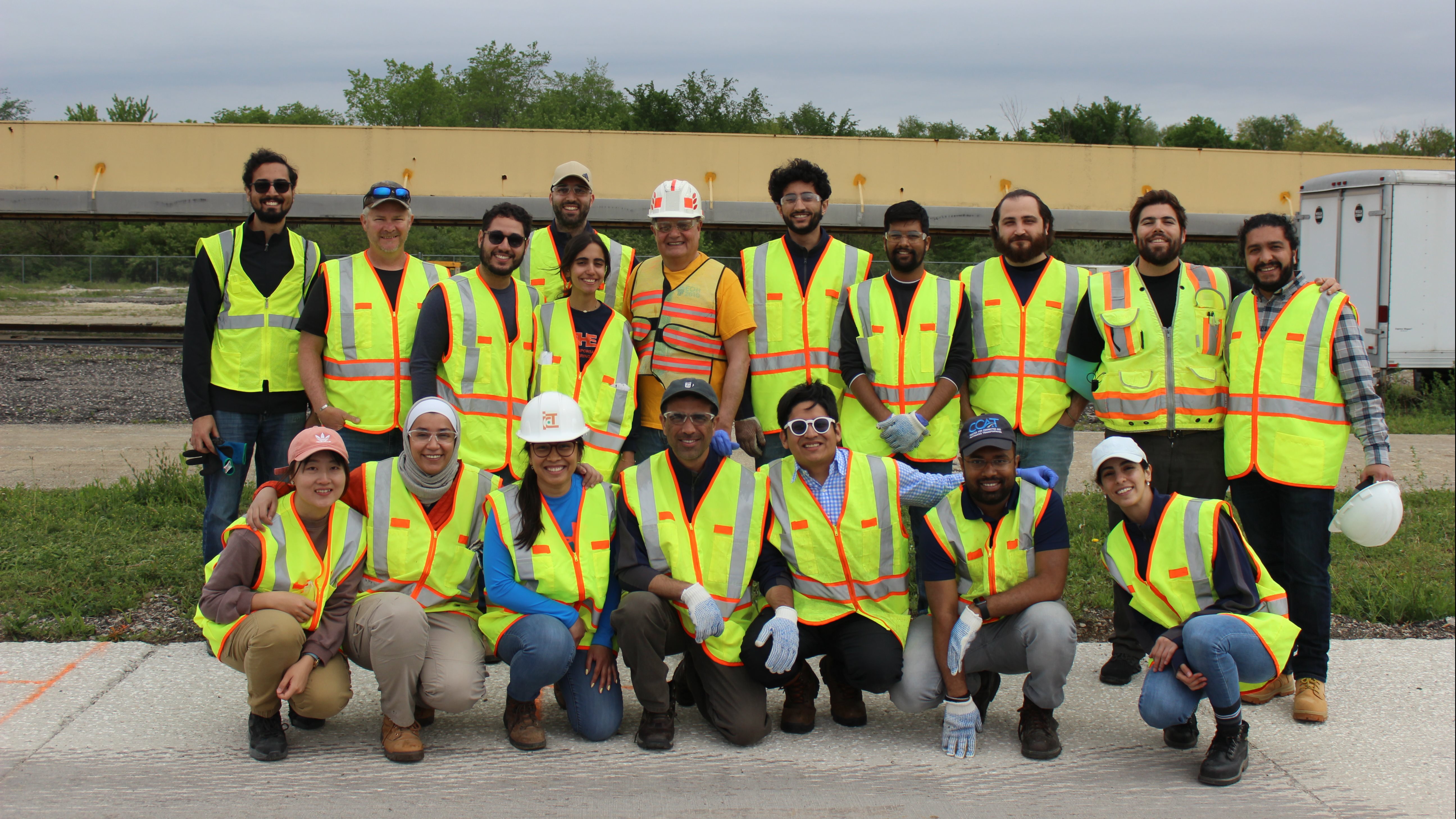 <span style="background-color: var(--engr-white);">Illinois Center for Transportation graduate students and staff smile with R27-216 project leads&nbsp;</span>Imad<span style="background-color: var(--engr-white);"> </span>Al-Qadi<span style="background-color: var(--engr-white);"> (top row, fifth from left) and </span>CEE<span style="background-color: var(--engr-white);"> graduate research assistant Javier </span>Garc&iacute;a<span style="background-color: var(--engr-white);"> </span>Mainieri<span style="background-color: var(--engr-white);"> (top row, second from right) after construction and instrumentation of the test area at </span>ICT<span style="background-color: var(--engr-white);"> on May 15.</span>