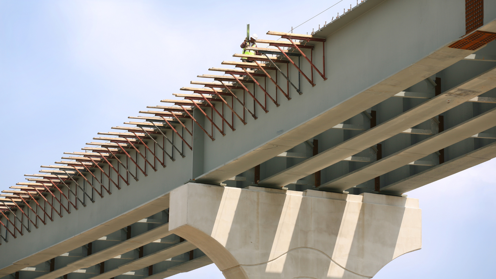 Accelerated bridge construction aims to reduce on-site construction time by constructing large sections of a bridge off-site and then installing them quickly, typically within 48 to 72 hours.