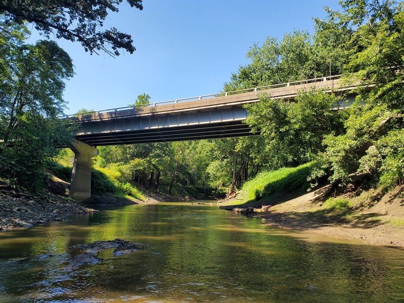 This bridge over the LaMoine River in Hancock County exemplifies Illinois' commitment to integrating infrastructure with environmental stewardship, ensuring the protection of waterways and their biodiversity. Photograph by Rachel Vinsel.