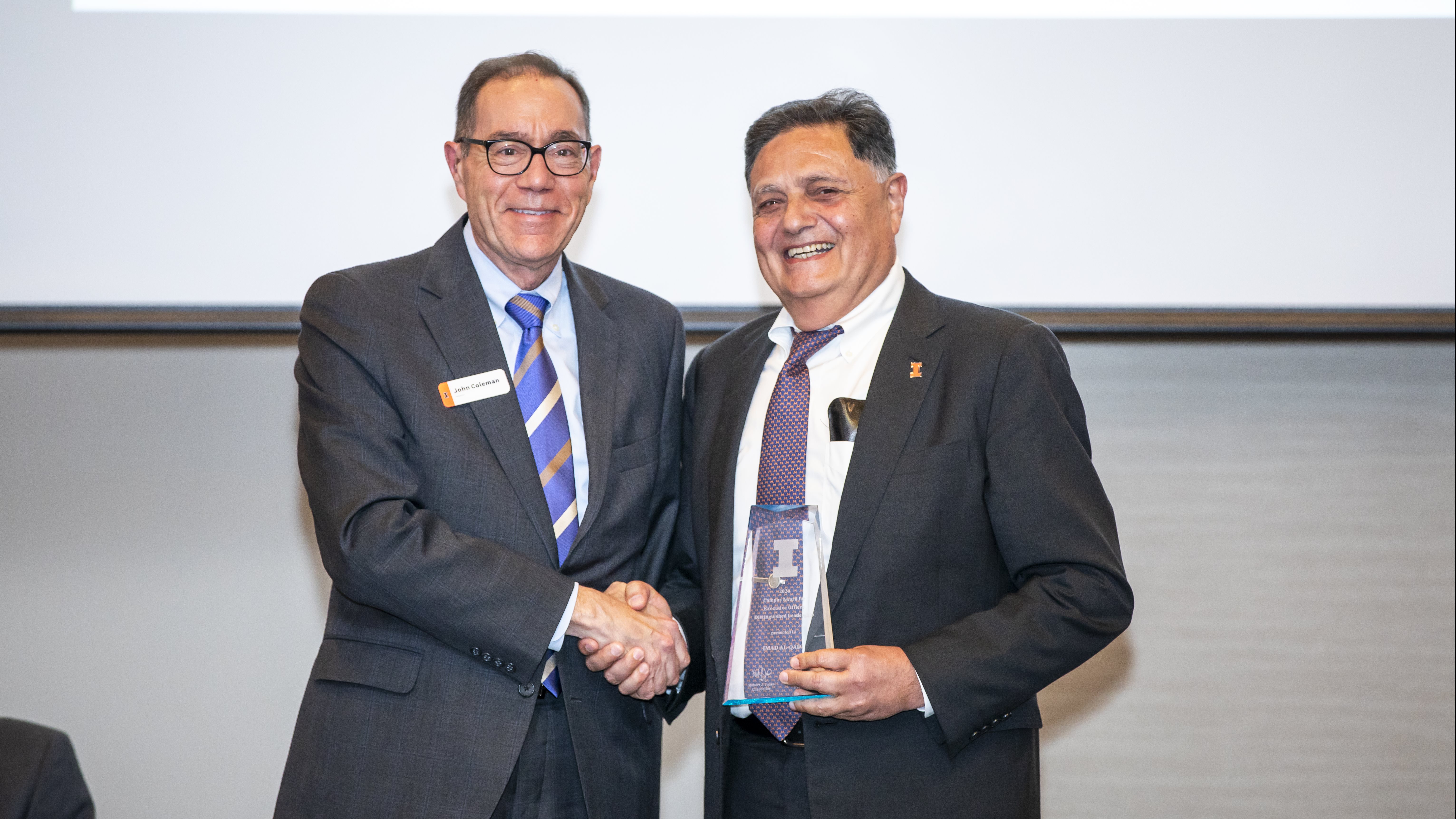 Imad Al-Qadi receives the Executive Officer Distinguished Leadership Award from John Coleman, University of Illinois Urbana-Champaign Vice Chancellor for Academic Affairs and Provost.
