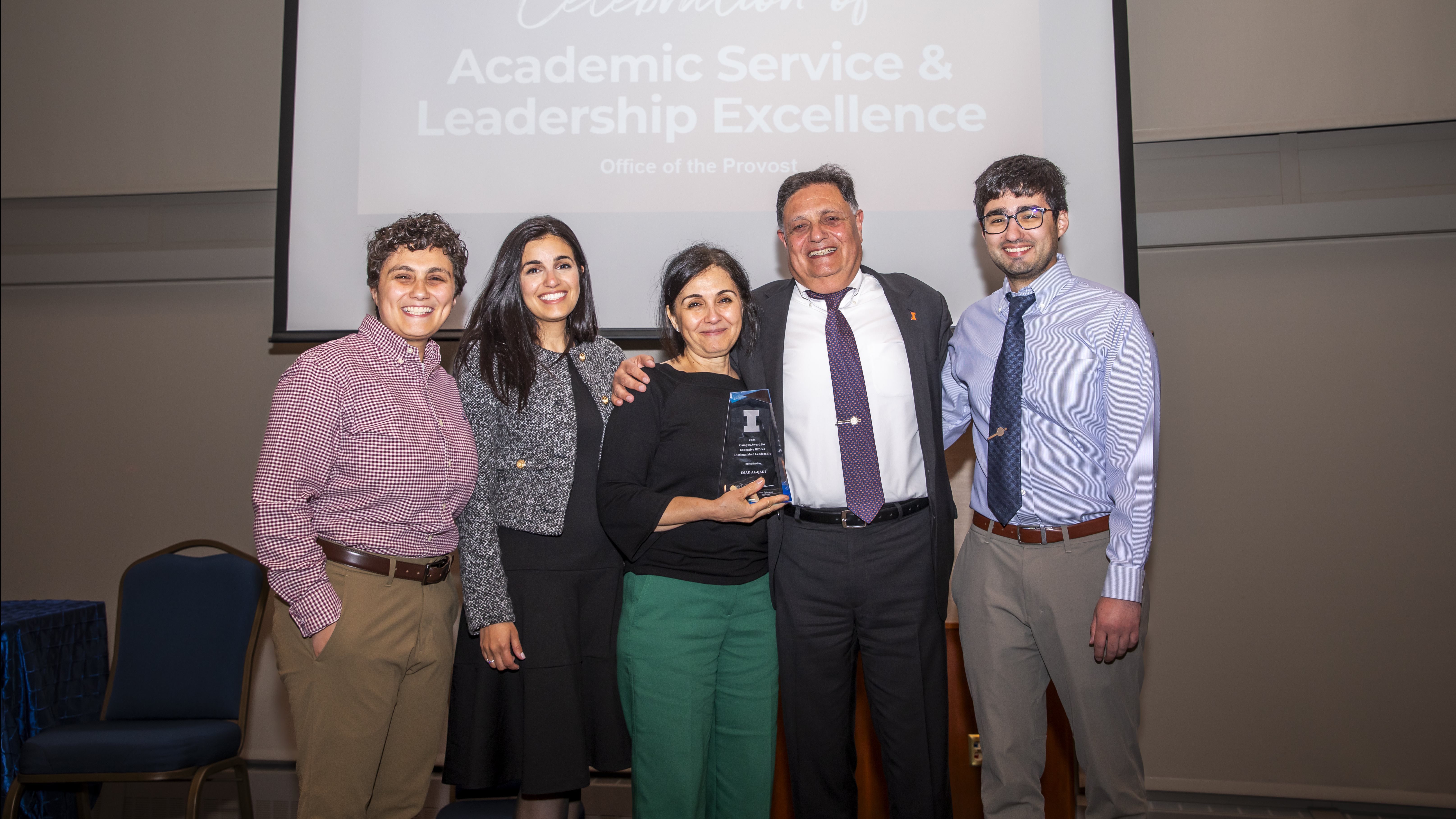 Al-Qadi smiles with his family at the award ceremony on May 14.